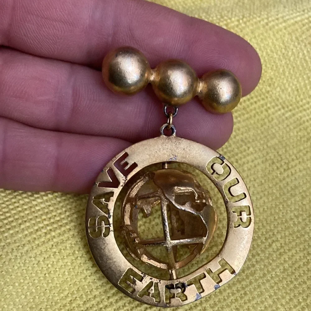 D torem renclif save our world vintage brooch